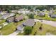 This aerial view captures the house, lawn, driveway, and neighborhood at 1407 Sunningdale Ln., Myrtle Beach, SC 29588