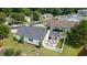 Aerial view of the backyard featuring a white picket fence, patio, and lake at 1407 Sunningdale Ln., Myrtle Beach, SC 29588