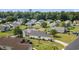This aerial view captures the backyard with the lake with a fountain, and neighborhood at 1407 Sunningdale Ln., Myrtle Beach, SC 29588