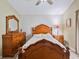Well-lit bedroom featuring a wooden frame bed and matching furniture at 1407 Sunningdale Ln., Myrtle Beach, SC 29588