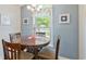 Cozy dining area with a round table, perfect for Gathering meals with natural light at 1407 Sunningdale Ln., Myrtle Beach, SC 29588