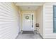 View of the decorated, covered front porch with room for seating at 1407 Sunningdale Ln., Myrtle Beach, SC 29588