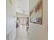 Inviting hallway view leading to a cozy living space with stylish decor and abundant natural light at 1407 Sunningdale Ln., Myrtle Beach, SC 29588