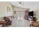 Comfortable living room featuring a plush sofa, glass coffee table, and access to an outdoor patio at 1407 Sunningdale Ln., Myrtle Beach, SC 29588