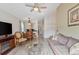 Cozy living space showcasing a comfortable sofa, coffee table, and a peek into the dining area at 1407 Sunningdale Ln., Myrtle Beach, SC 29588