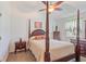 Elegant main bedroom featuring a four-poster bed, dark wood furniture, and neutral tones at 1407 Sunningdale Ln., Myrtle Beach, SC 29588