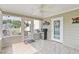 Enclosed patio area with ceiling fan, grill, and seating at 1407 Sunningdale Ln., Myrtle Beach, SC 29588