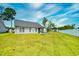 This lovely backyard boasts a screened-in porch and fire pit, with views of the surrounding pond and privacy fence at 1412 Reid Ct., Myrtle Beach, SC 29588