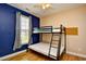 Comfortable bedroom with bunk beds, neutral walls, and a window for natural light at 1412 Reid Ct., Myrtle Beach, SC 29588