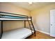 Bright bedroom features bunk beds, neutral colored walls, and wood flooring at 1412 Reid Ct., Myrtle Beach, SC 29588