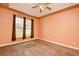 Spacious bedroom features natural light, neutral carpeting and a ceiling fan at 1412 Reid Ct., Myrtle Beach, SC 29588