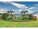 Lawson's Landing entrance framed by colorful flowers and palm trees at 1412 Reid Ct., Myrtle Beach, SC 29588