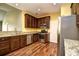 Kitchen featuring stainless appliances, granite counters, and dark wood cabinetry at 1412 Reid Ct., Myrtle Beach, SC 29588