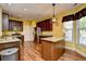 Modern kitchen with stainless steel appliances, granite countertops, and dark wood cabinets at 1412 Reid Ct., Myrtle Beach, SC 29588