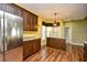 Well-lit kitchen with stainless steel appliances, wooden cabinets, and granite countertops at 1412 Reid Ct., Myrtle Beach, SC 29588