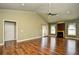 Spacious living room with a fireplace, wood floors, and sliding glass doors at 1412 Reid Ct., Myrtle Beach, SC 29588