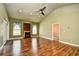 Bright living room featuring vaulted ceilings, fireplace, and wood-look flooring at 1412 Reid Ct., Myrtle Beach, SC 29588