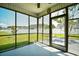 Relaxing screened porch with outdoor view of the backyard and neighborhood homes at 1412 Reid Ct., Myrtle Beach, SC 29588
