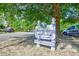 Lawson's Landing boat landing sign nestled among mature trees, promising exclusive access for residents at 1412 Reid Ct., Myrtle Beach, SC 29588