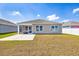 Well-maintained backyard featuring a cozy screened-in porch and a concrete patio extension at 142 Pine Forest Dr., Conway, SC 29526