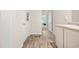A light filled, practical bathroom featuring wood floors and easy access to the bedrooms at 142 Pine Forest Dr., Conway, SC 29526