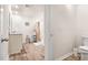 A clean and functional bathroom with a shower, toilet, and vanity with lots of light at 142 Pine Forest Dr., Conway, SC 29526