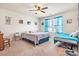 A cozy bedroom filled with lots of light, featuring two beds and bright blue curtains at 142 Pine Forest Dr., Conway, SC 29526