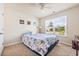Bright bedroom with a large window, ceiling fan and plush carpet at 142 Pine Forest Dr., Conway, SC 29526