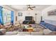 Cozy living room featuring a ceiling fan, a stylish rug, and comfortable seating arrangements at 142 Pine Forest Dr., Conway, SC 29526