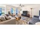 Comfortable living room featuring an area rug, large TV, and seating area with lots of light at 142 Pine Forest Dr., Conway, SC 29526