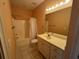 Full bathroom featuring a vanity, mirror, tub, and tiled floors at 1428 Saint Thomas Circle # B-1, Myrtle Beach, SC 29577