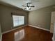 Bedroom featuring hardwood floors and large window at 1428 Saint Thomas Circle # B-1, Myrtle Beach, SC 29577