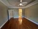 Spacious main bedroom with tray ceiling and view to en suite bathroom at 1428 Saint Thomas Circle # B-1, Myrtle Beach, SC 29577