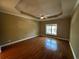Large bedroom with hardwood floors and a ceiling fan at 1428 Saint Thomas Circle # B-1, Myrtle Beach, SC 29577