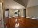 Open-concept living room with hardwood floors and a view into the kitchen at 1428 Saint Thomas Circle # B-1, Myrtle Beach, SC 29577