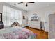 Bedroom with hardwood floors, a ceiling fan, and a bright sunny window at 149 Ella Kinley Circle # 302, Myrtle Beach, SC 29588