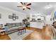 Open-concept living room with hardwood floors, crown molding, and a view into the kitchen at 149 Ella Kinley Circle # 302, Myrtle Beach, SC 29588