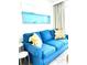 Cozy living room with stylish blue sofa and modern artwork at 161 Seawatch Dr. # 710, Myrtle Beach, SC 29572