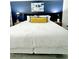 Inviting main bedroom with king bed, stylish lamps, accent wall, and modern artwork at 161 Seawatch Dr. # 710, Myrtle Beach, SC 29572