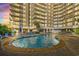 Outdoor pool near building with multiple levels and lounge chairs for relaxing at 161 Seawatch Dr. # 710, Myrtle Beach, SC 29572