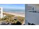 Beach view from a condo balcony, with palm trees, beach and ocean at 1805 Windmere W S Ocean Blvd. # 1109, Myrtle Beach, SC 29575