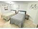 Bedroom with two beds, stylish decor, and ample lighting at 1805 Windmere W S Ocean Blvd. # 1109, Myrtle Beach, SC 29575