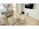 Cozy living room with a sofa, coffee table, TV, and breakfast bar with stools at 1805 Windmere W S Ocean Blvd. # 1109, Myrtle Beach, SC 29575