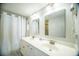 Well-lit bathroom featuring double sinks, and modern fixtures at 1903 S Ocean Blvd. # 1110, North Myrtle Beach, SC 29582