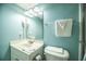 Clean bathroom with a corner sink, a large mirror, and fresh towels at 1903 S Ocean Blvd. # 1110, North Myrtle Beach, SC 29582