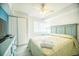 Relaxing bedroom with natural light, ceiling fan, and ample closet space at 1903 S Ocean Blvd. # 1110, North Myrtle Beach, SC 29582