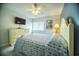 Bright bedroom featuring a wall-mounted TV and coastal-themed decor at 1903 S Ocean Blvd. # 1110, North Myrtle Beach, SC 29582