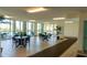 Bright common area with floor-to-ceiling windows and stylish tables, perfect for gatherings and socializing at 1903 S Ocean Blvd. # 1110, North Myrtle Beach, SC 29582