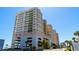 Exterior low-angle shot showcasing the condo's multiple floors and balcony views at 1903 S Ocean Blvd. # 1110, North Myrtle Beach, SC 29582