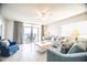 Inviting living room with plush seating, a ceiling fan, and access to a balcony with ocean views at 1903 S Ocean Blvd. # 1110, North Myrtle Beach, SC 29582